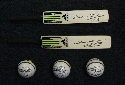 Miniature bats and cricket balls signed by Darren Gough